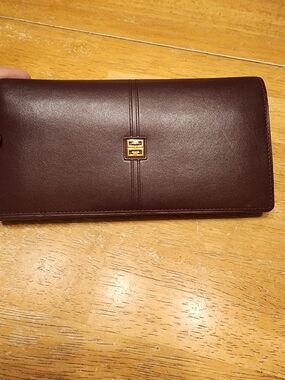 vintage Givenchy burgundy leather long wallet features a sleek slim flap design